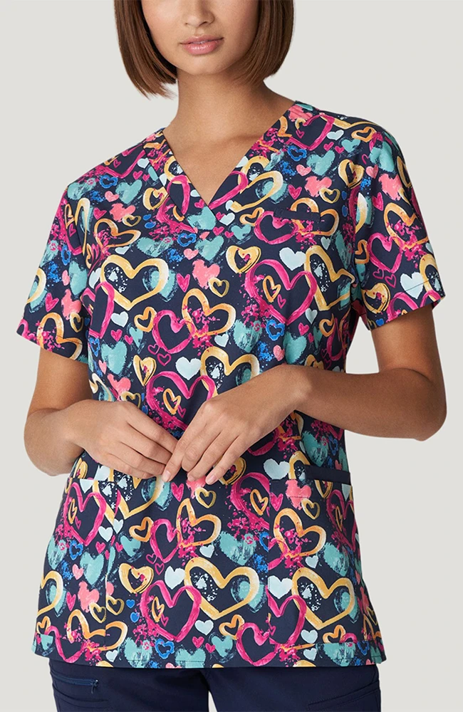 White Cross Women's V-Neck All You Need Is Luv Print Scrub Top